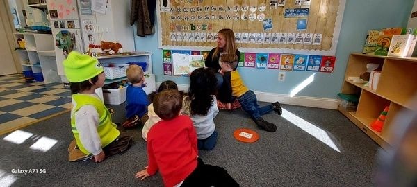 Teacher with children in circle time